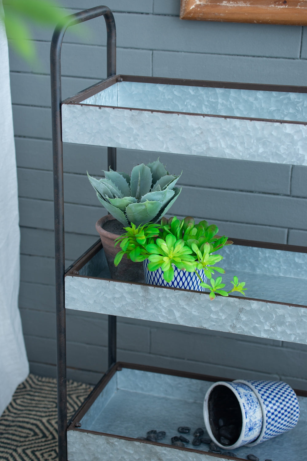 Galvanized tiered plant stand with rustic charm