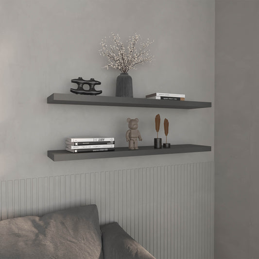 Gray floating shelf with modern black sculpture and floral vase
