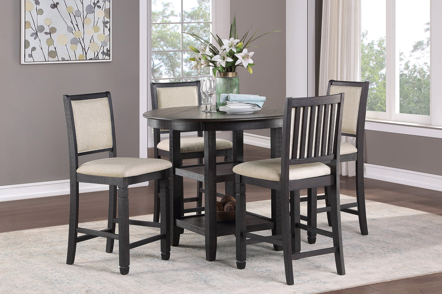 Dark wood round counter height table with four upholstered bar stools