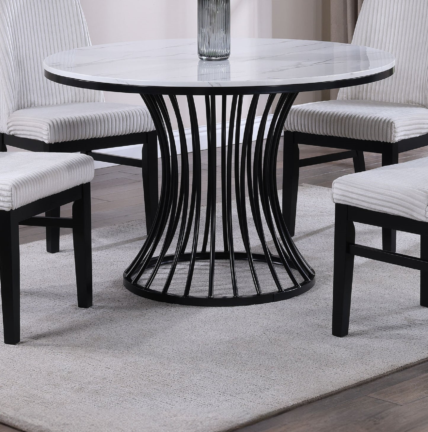 Round marble top dining table with black metal base
