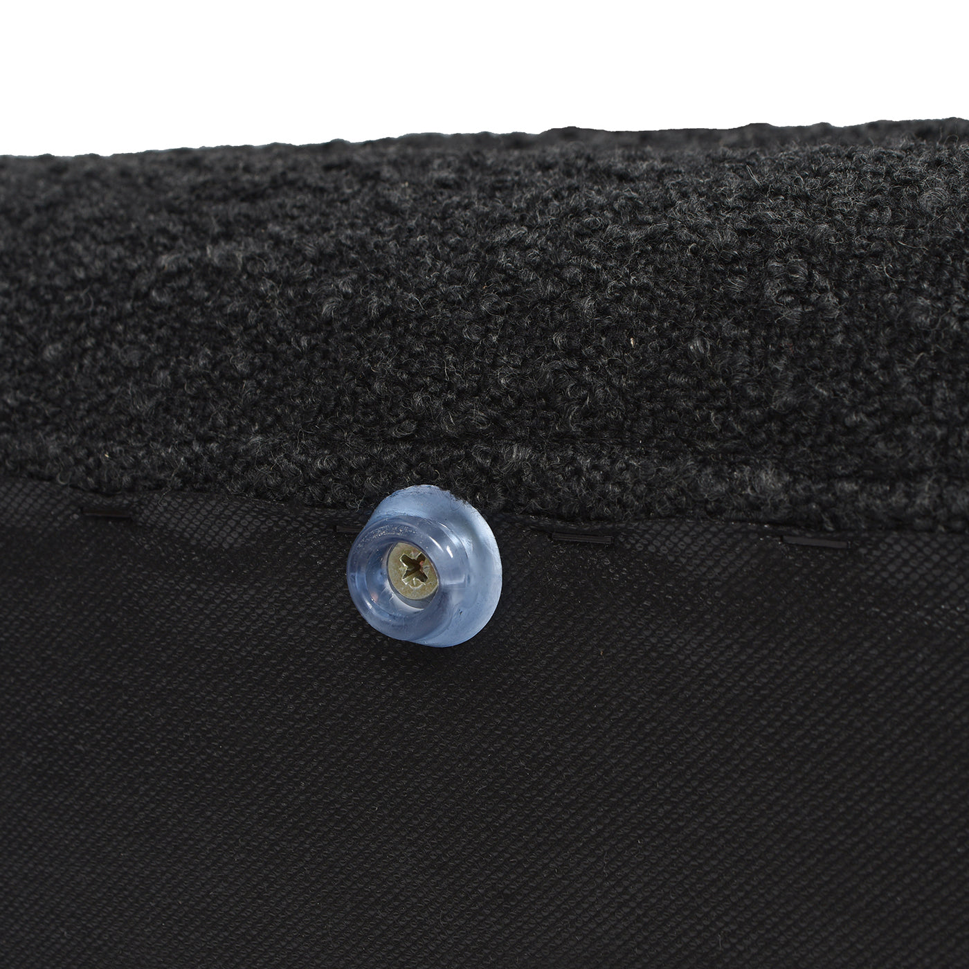 Black textured fabric with clear plastic furniture foot