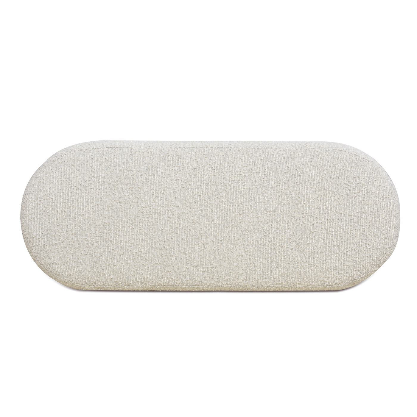 Cream boucle fabric ottoman with rounded edges and plush texture