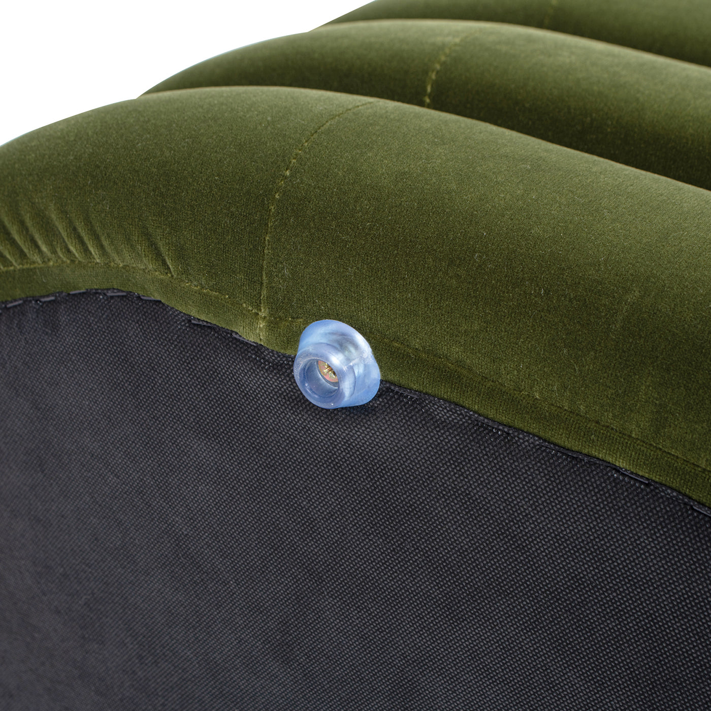 Green velvet air mattress detail with transparent valve