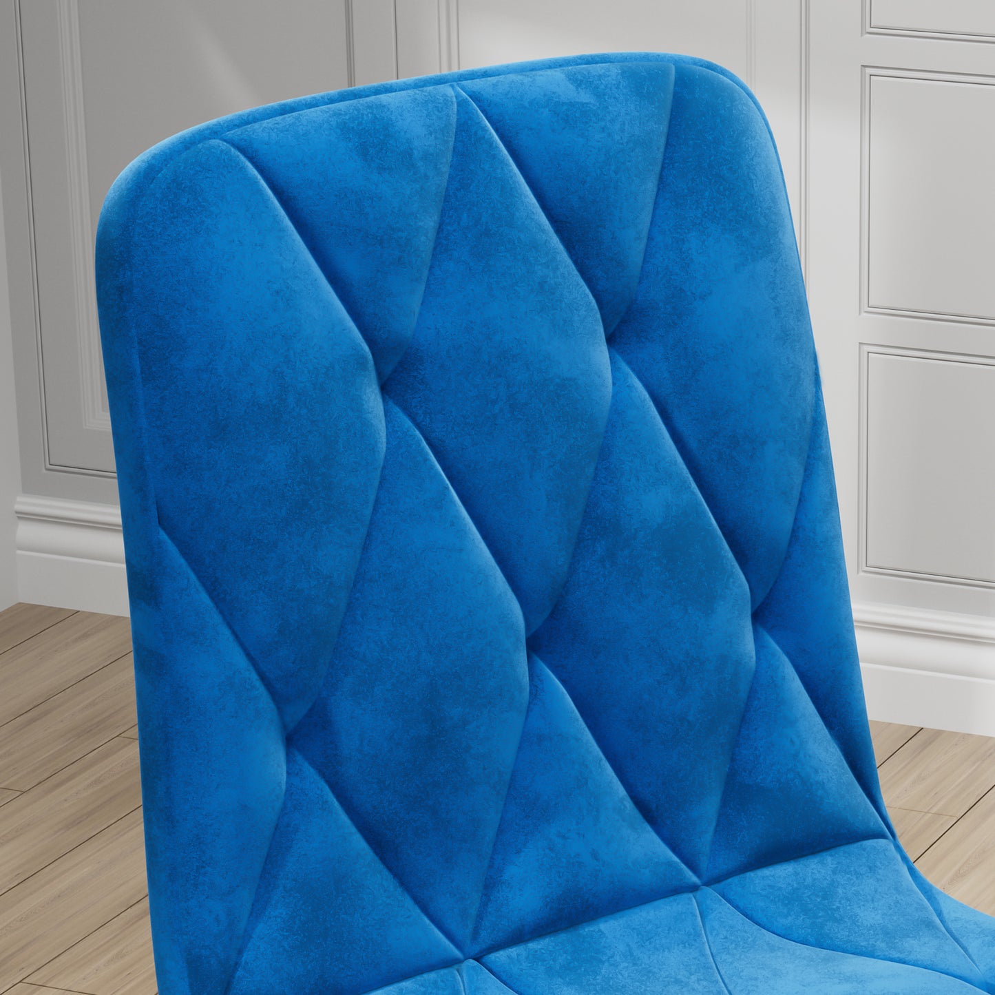 Closeup of plush blue velvet chair back with diamond tufting detail