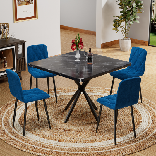 Marble dining table with four blue velvet chairs and crisscross legs