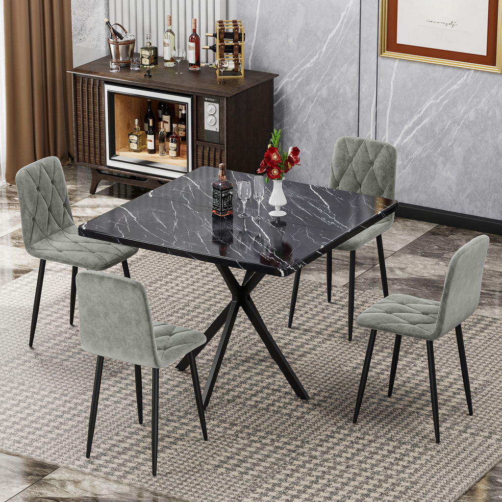 Black marble top dining table with grey upholstered chairs