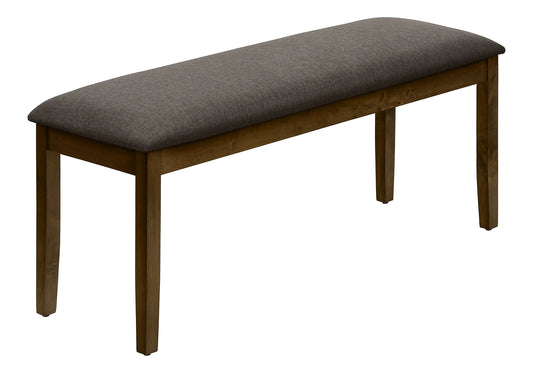 Dark gray upholstered bench with tapered wooden legs ideal for dining rooms