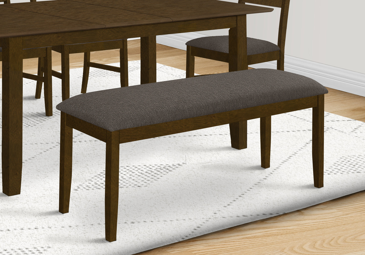 Dark brown wooden dining bench with grey upholstered seat