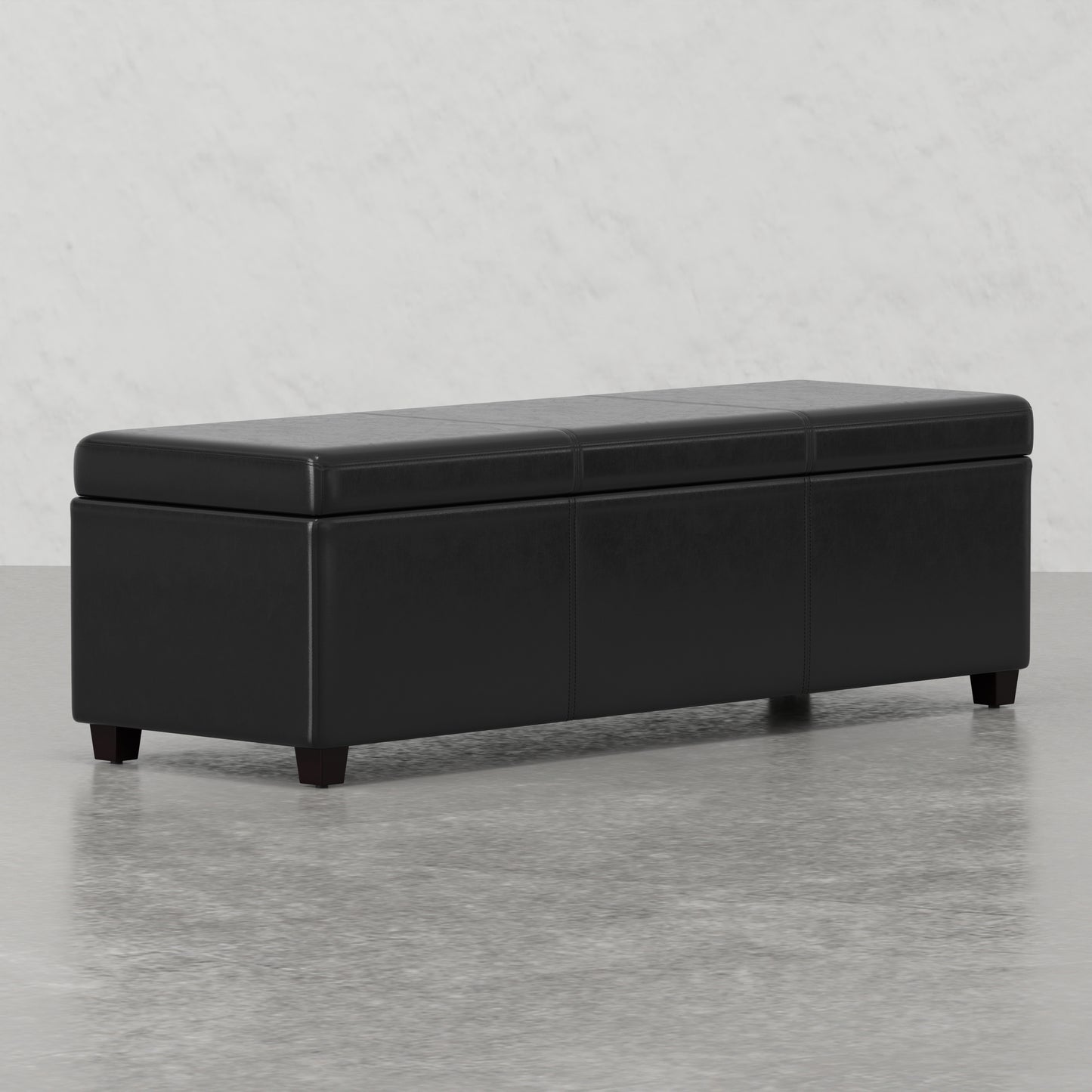 Black faux leather storage ottoman with stitching details