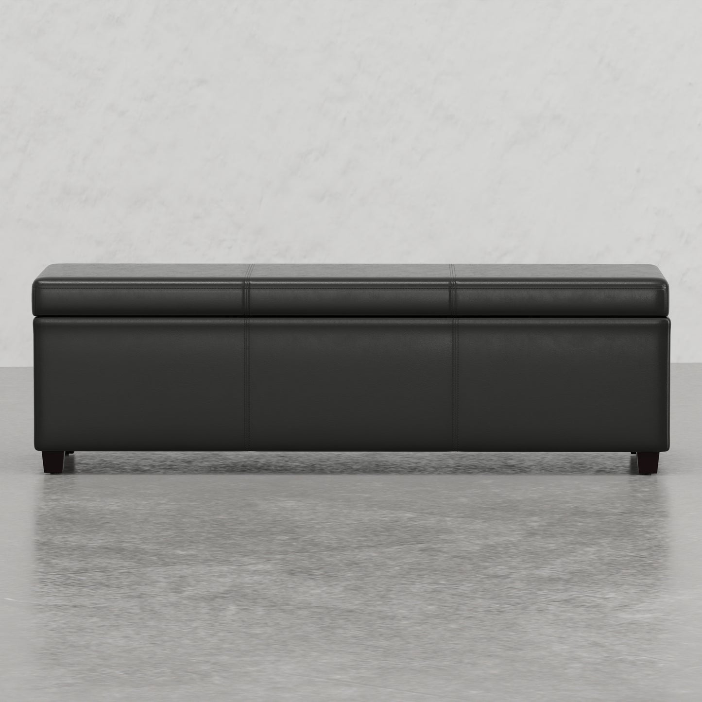 Black faux leather storage ottoman with stitched lid