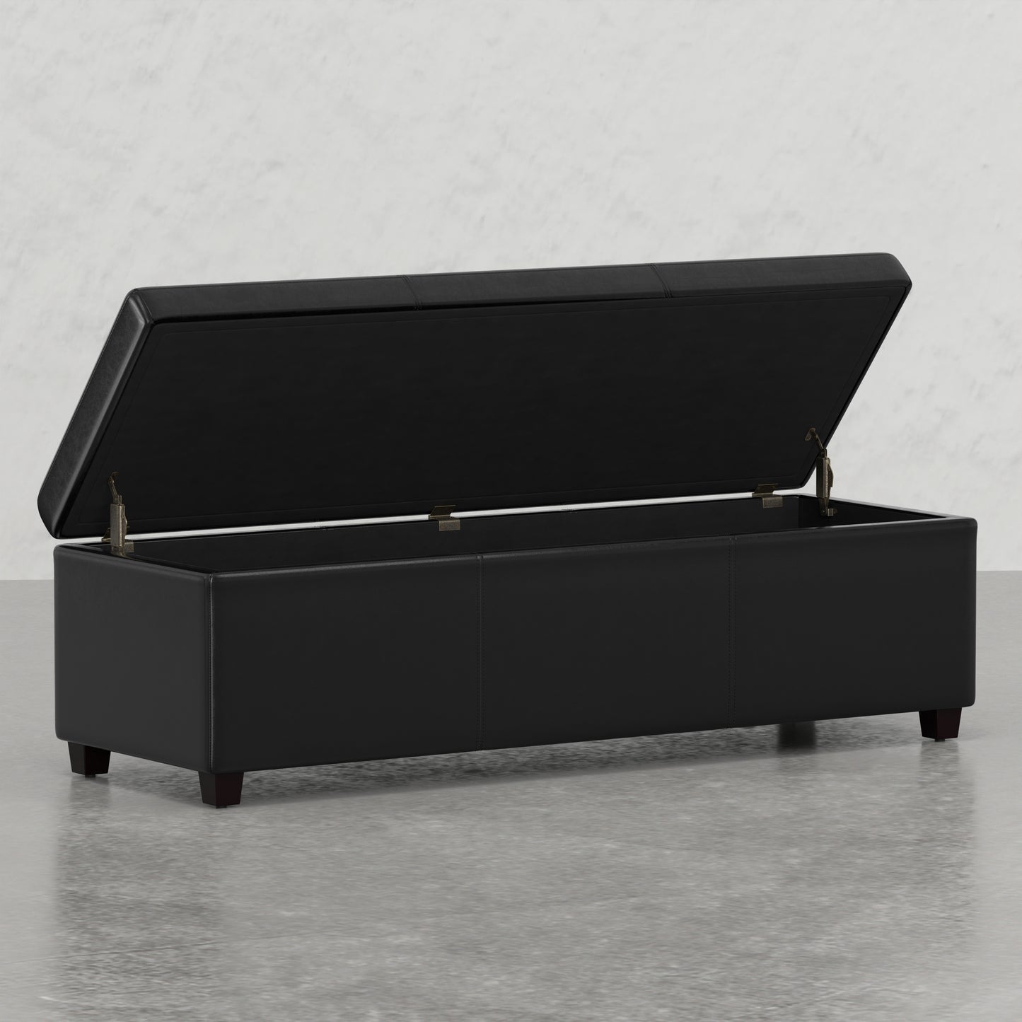 Black leather storage ottoman with lid open