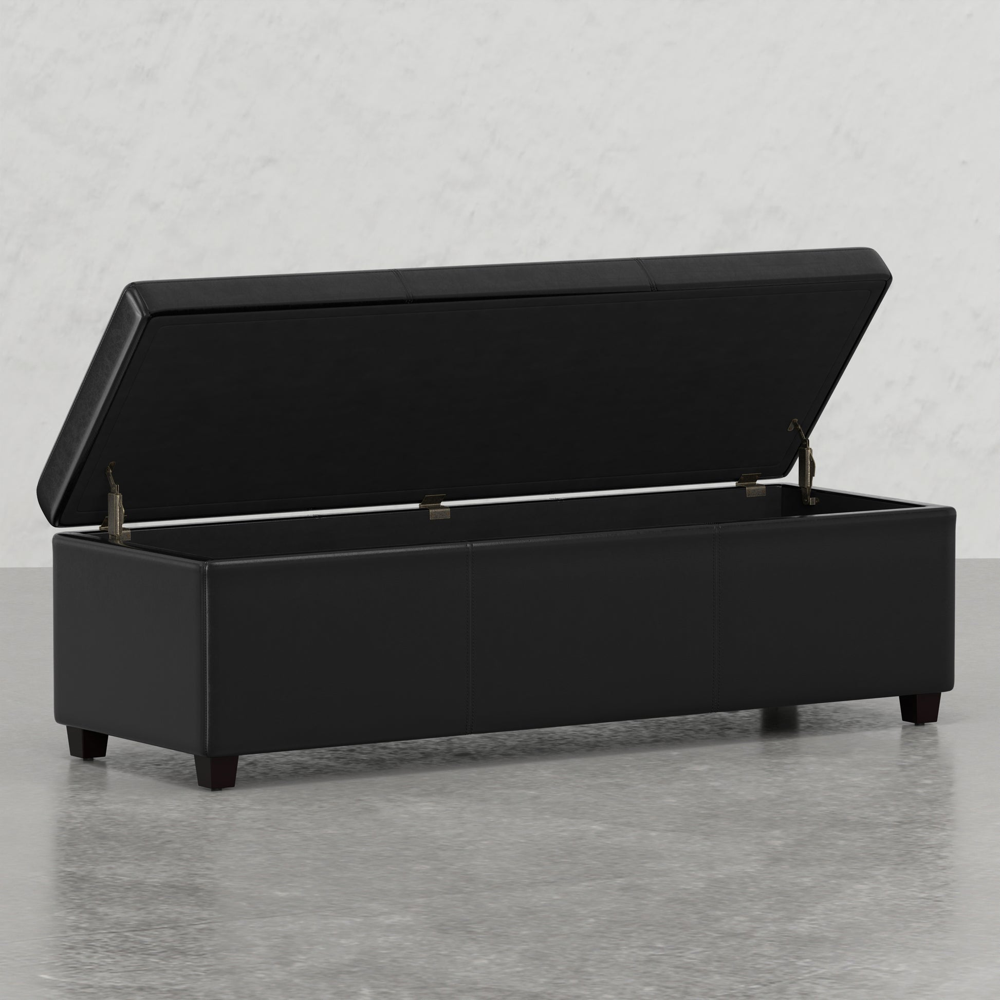 Black leather storage ottoman with lid open