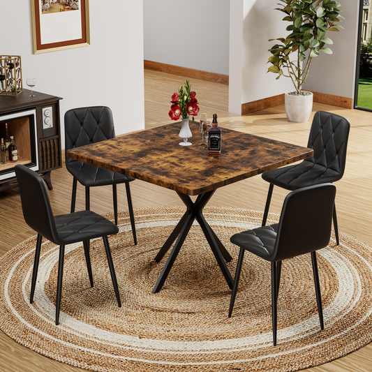 Rustic wood dining table with black metal legs and four black diamondstitched chairs