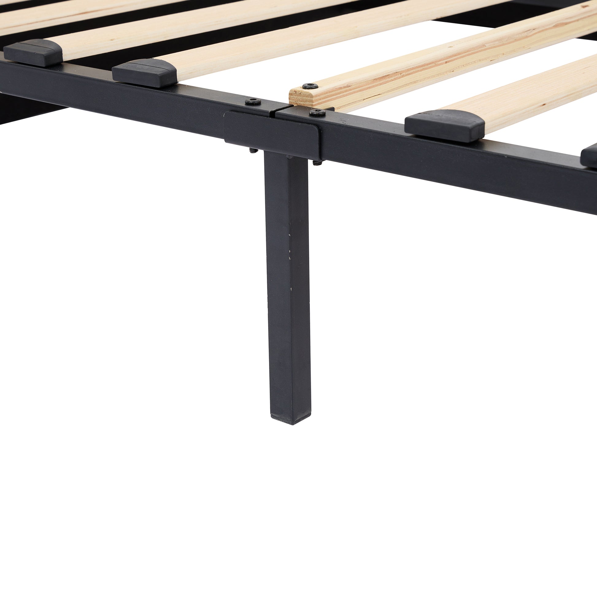 Closeup of black metal bed frame with wooden slats and black protective caps