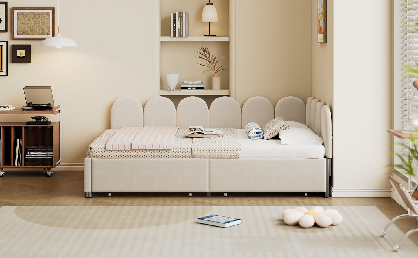 Beige upholstered twin bed with scalloped headboard and pink quilt