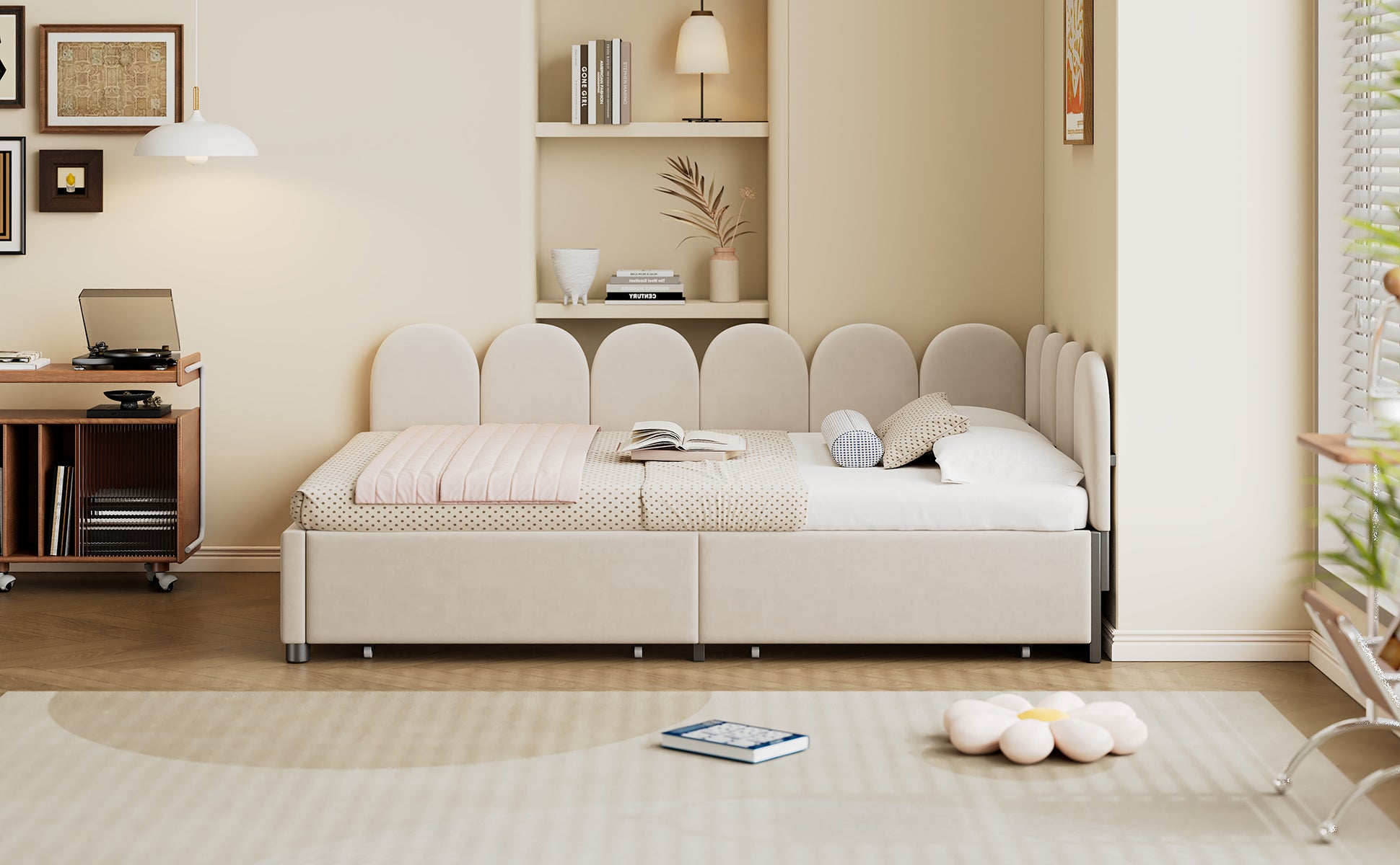 Beige upholstered twin bed with scalloped headboard and pink quilt