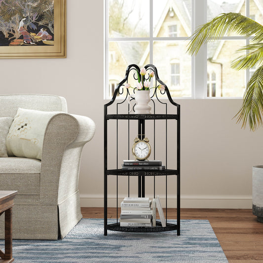 Elegant black metal corner shelf with decorative scrolls holding books and a vase