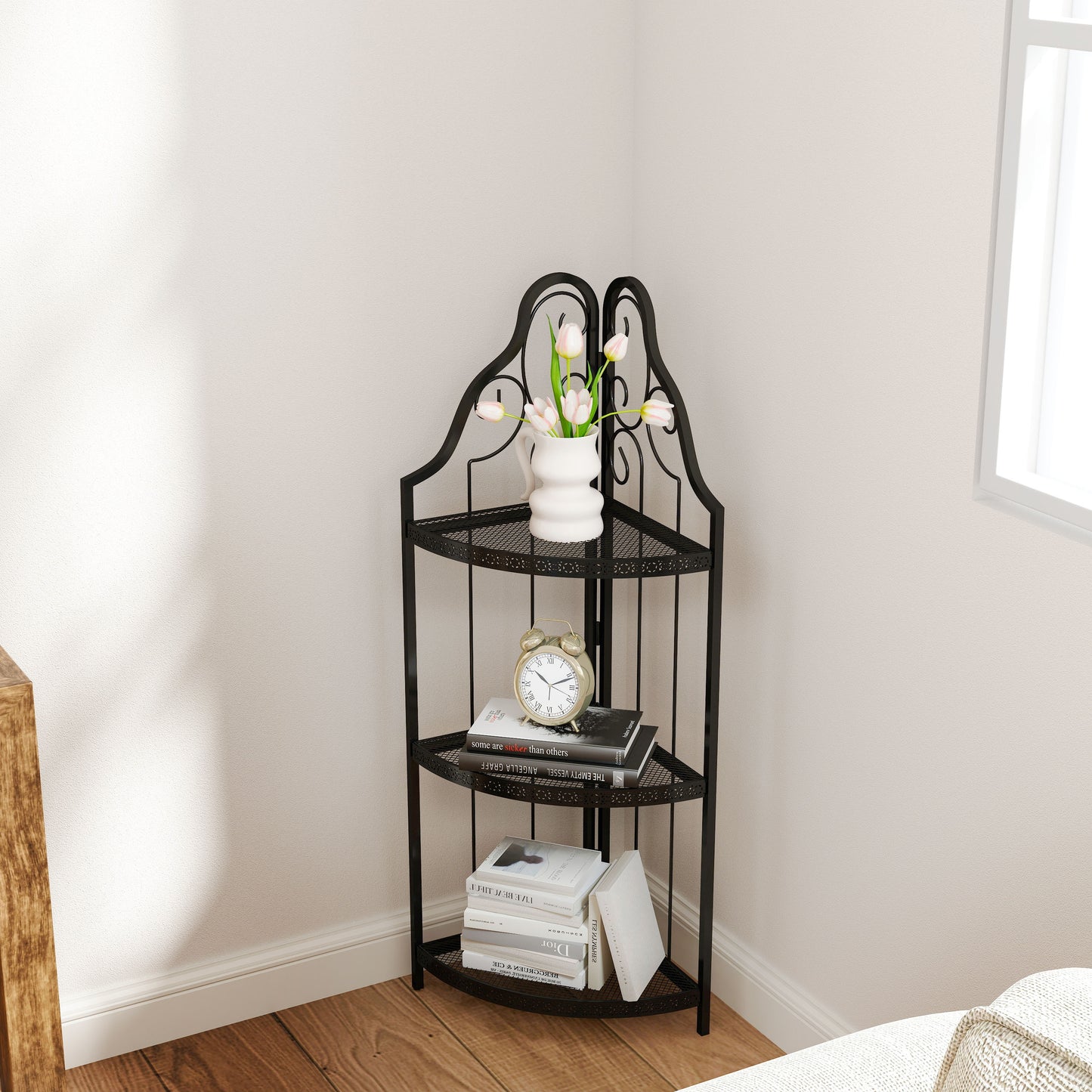 Black wrought iron tier corner shelf with ornate scrollwork