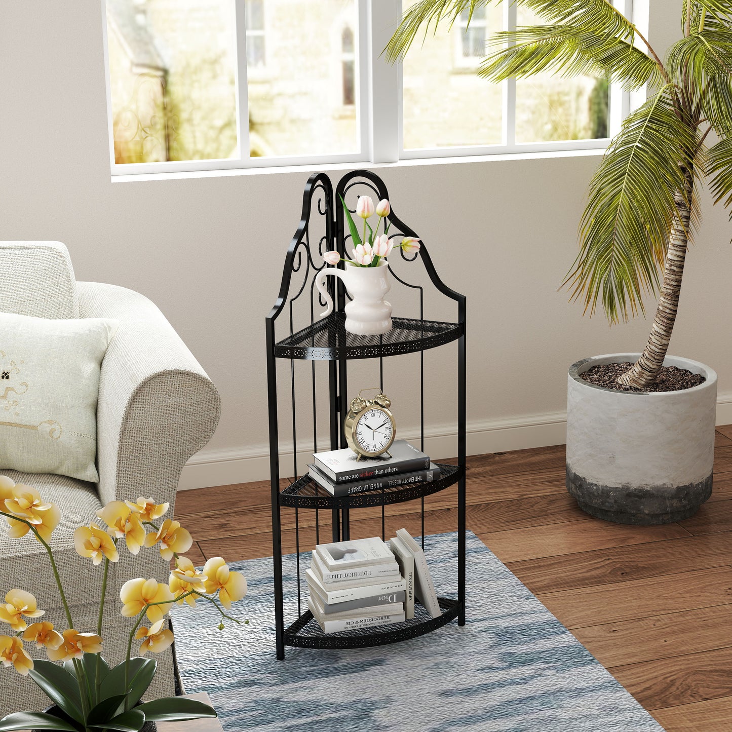 Black wrought iron tier corner shelf with books and vase of tulips