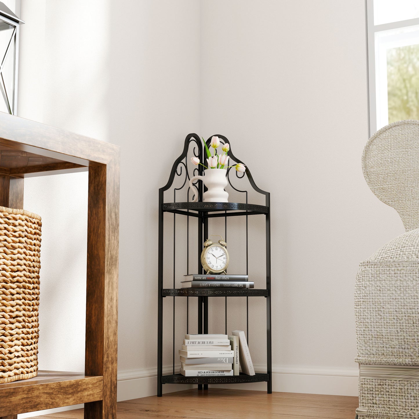 Black metal corner shelf with ornate scrollwork holding books and decor