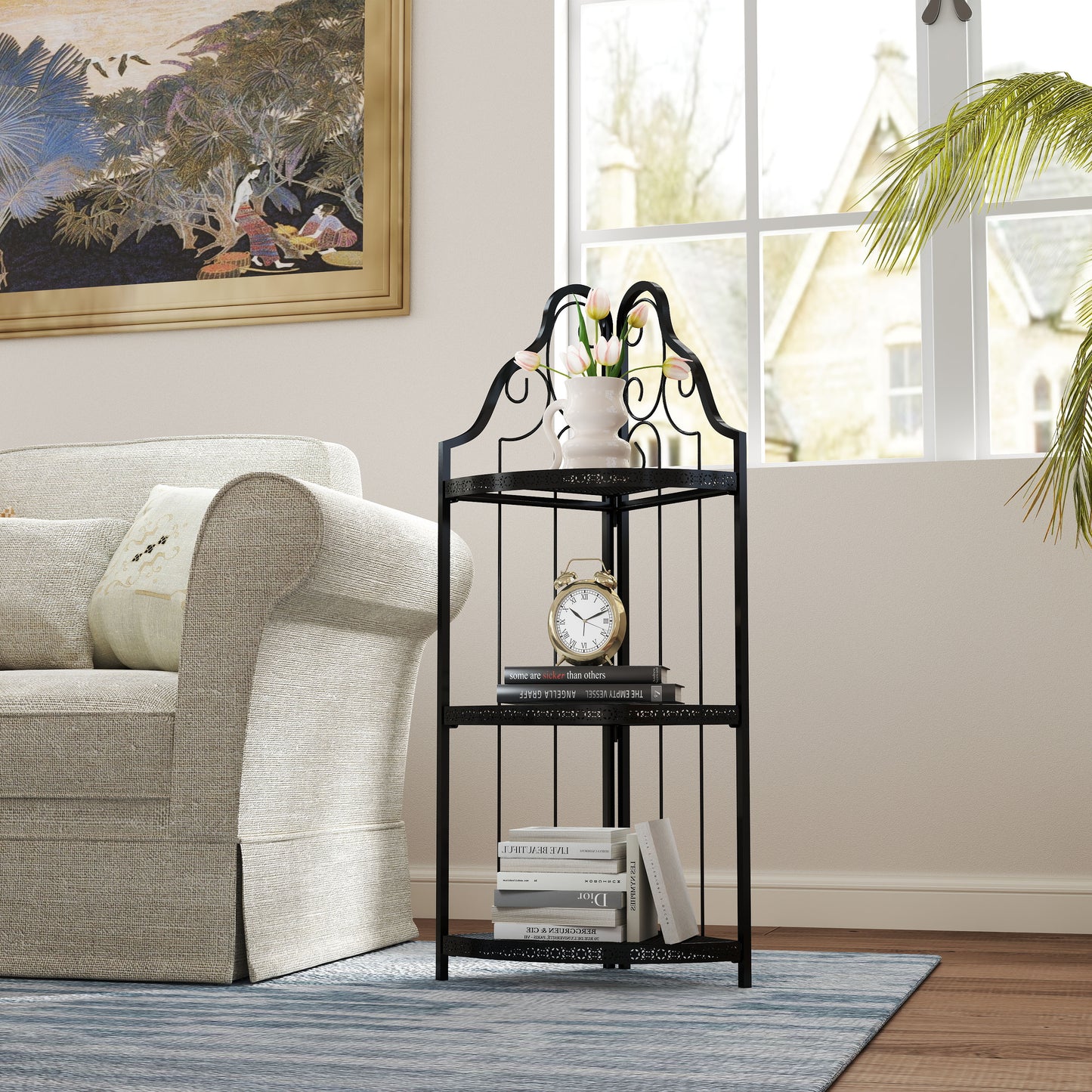 Black metal corner shelf with ornate scrolls and three tiered shelves