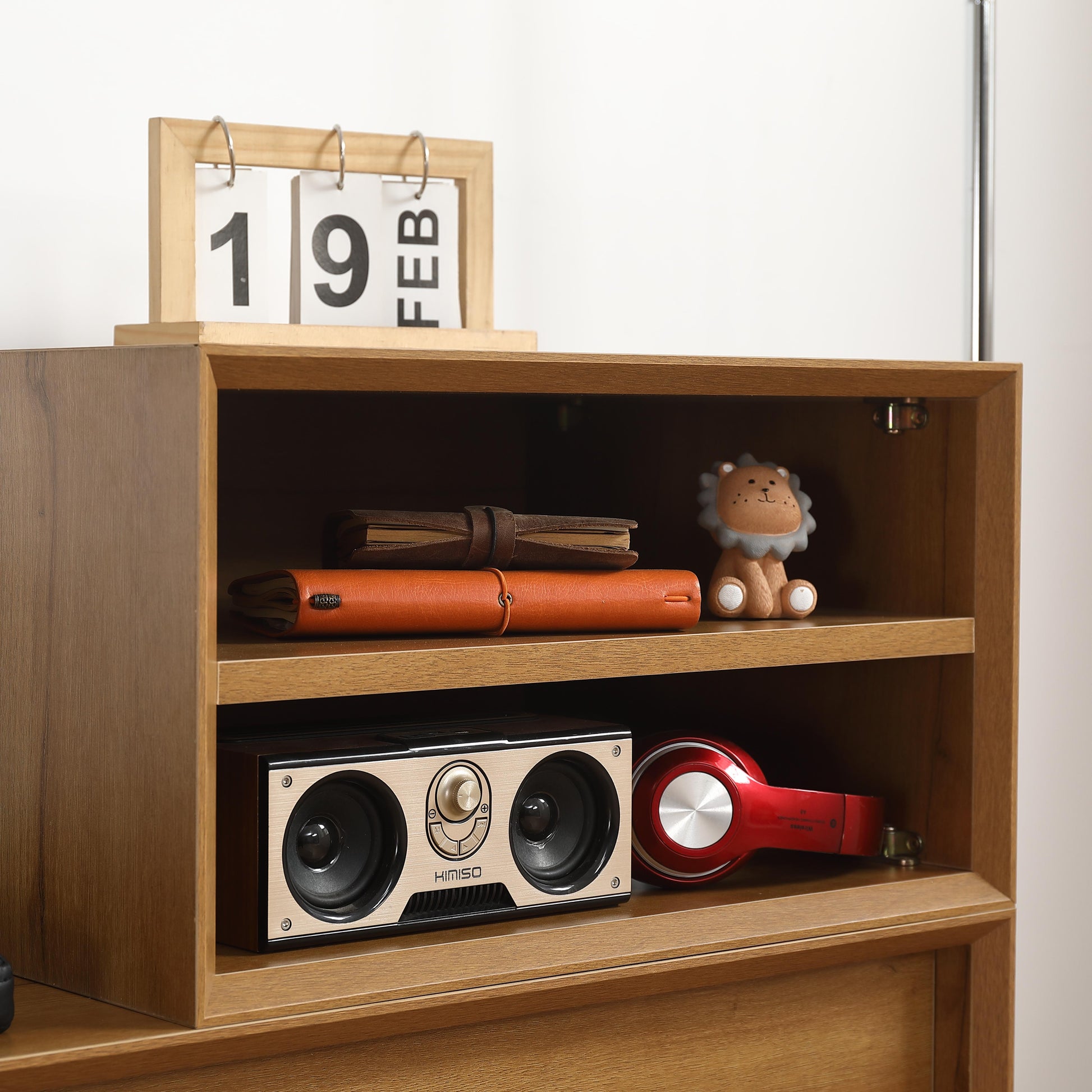 Wooden desk calendar with  FEB visible