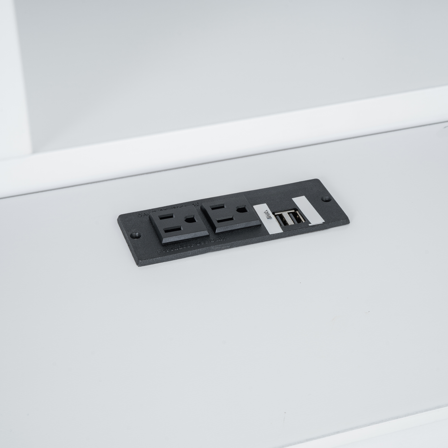 Black power outlet strip with two AC sockets and two USB ports for convenient charging