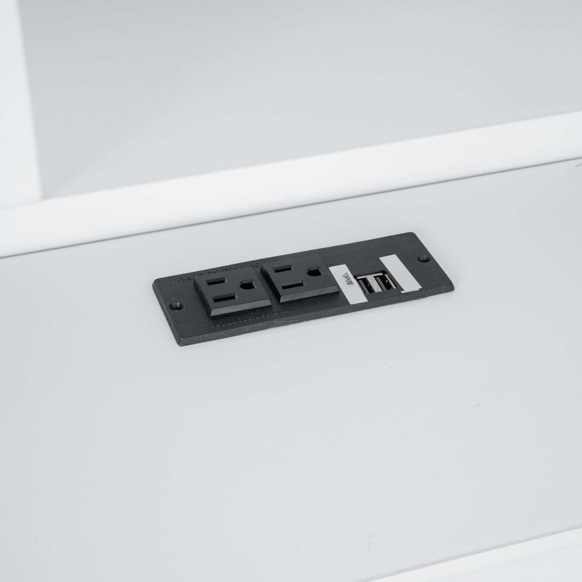Black power outlet strip with two AC sockets and two USB ports for convenient charging
