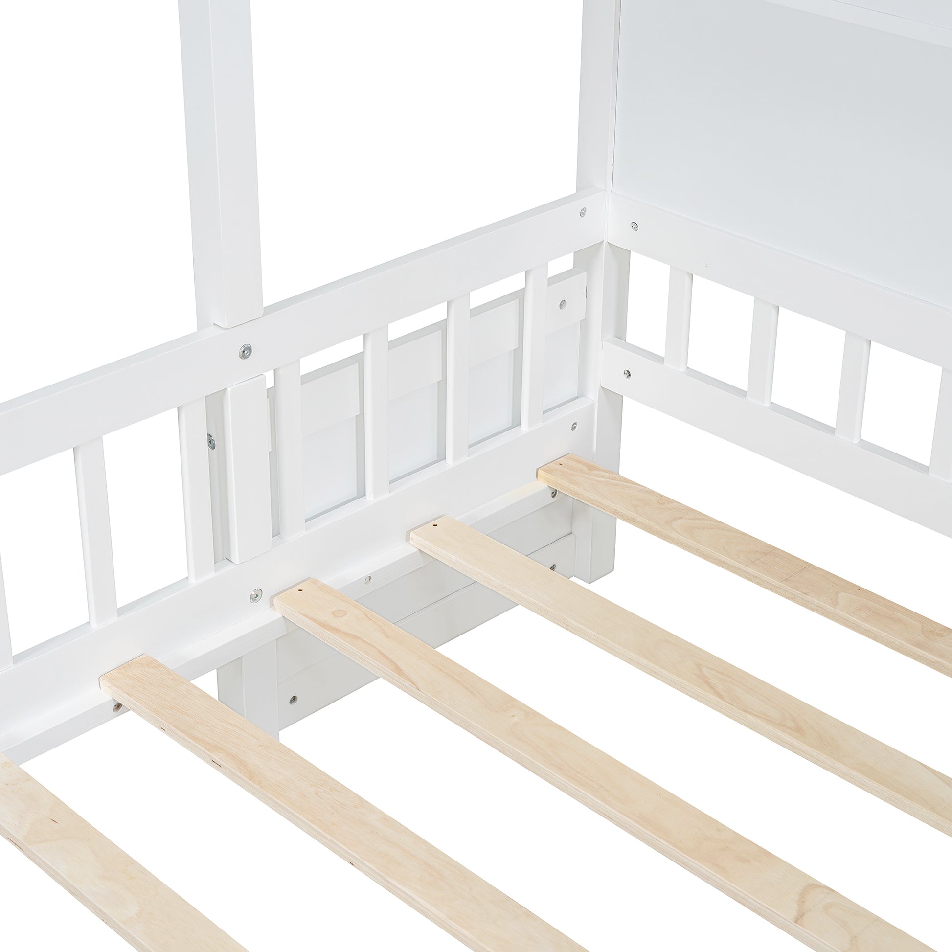 White wooden house bed frame detail with slatted base