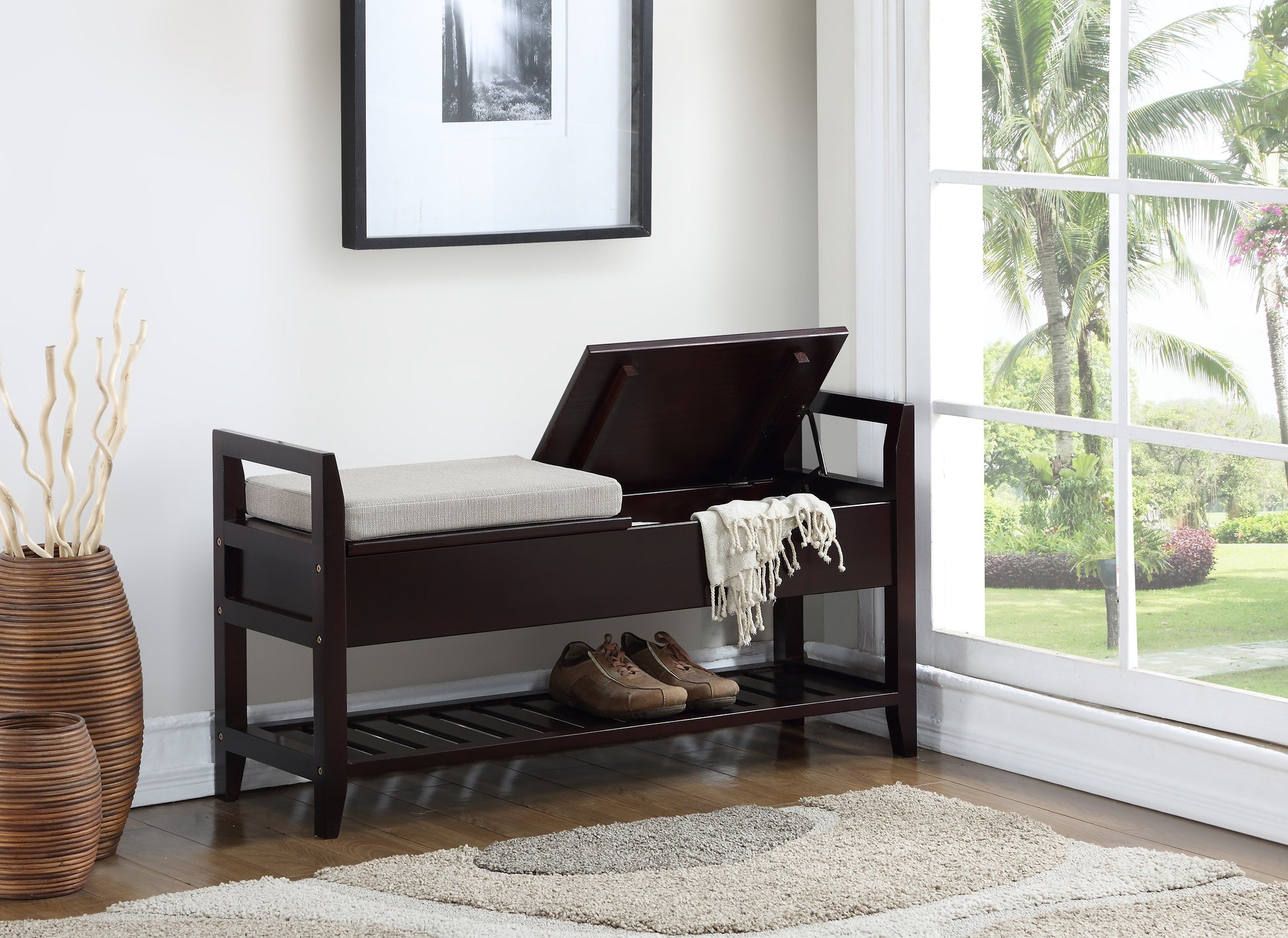 Dark brown wood storage bench with a light beige upholstered seat and shoe rack