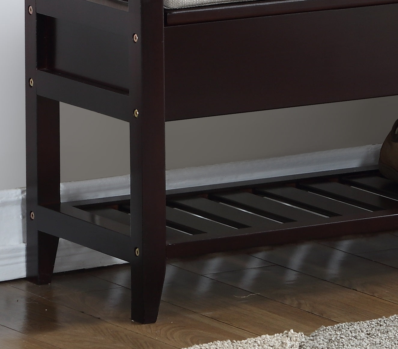 Dark brown wooden storage bench with slatted shoe rack