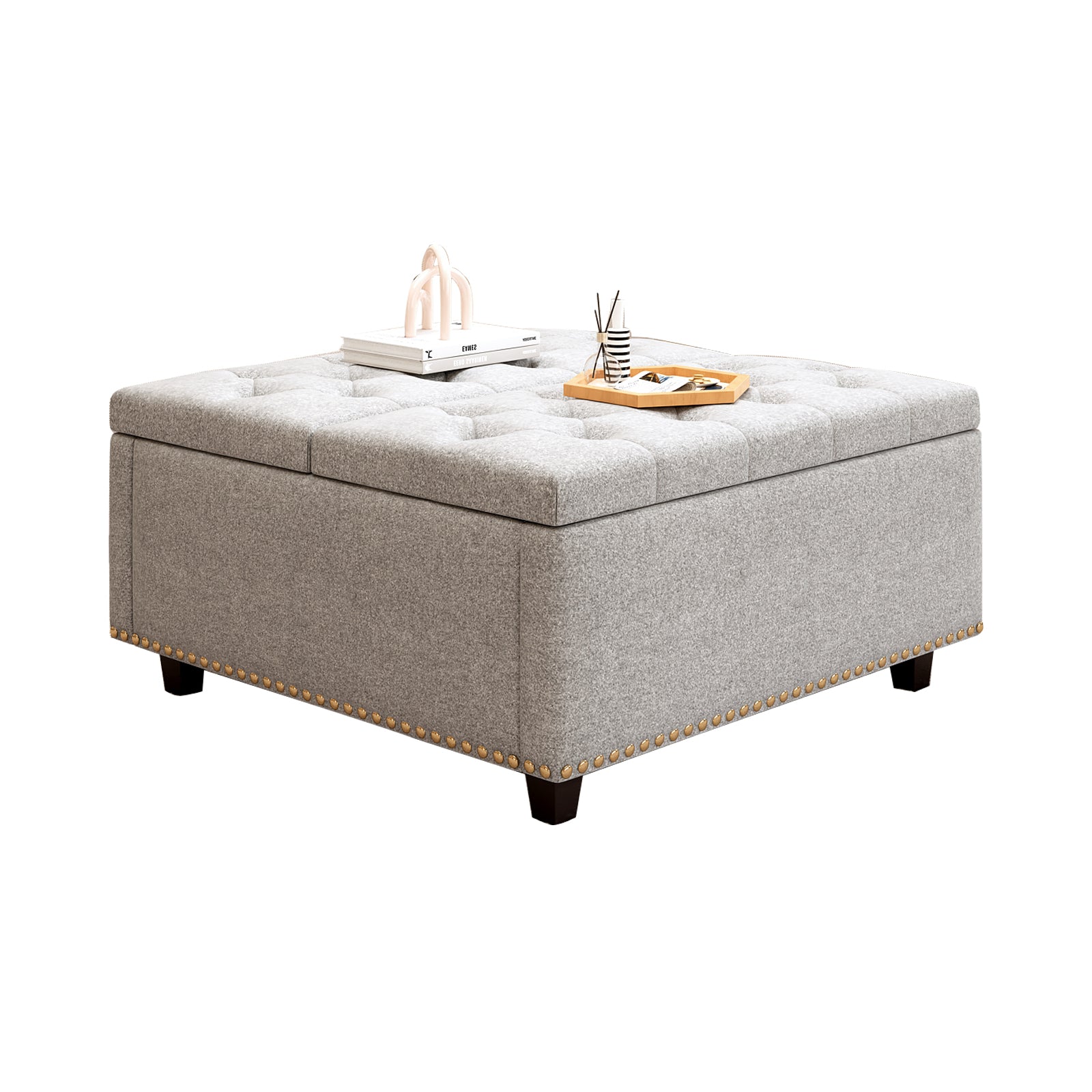 Gray tufted storage ottoman with nailhead trim and dark wooden legs