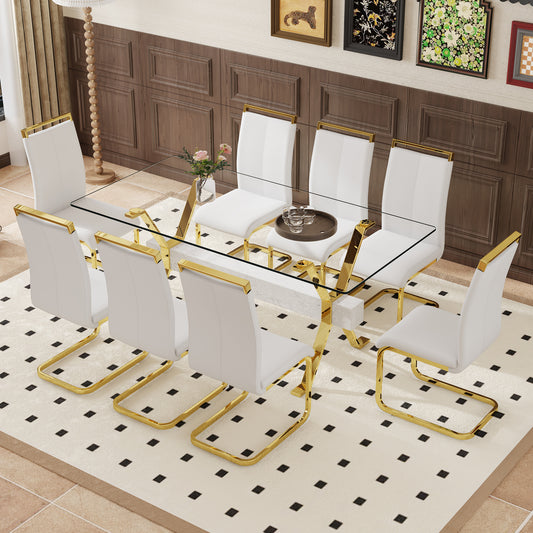 White leather dining chairs with gold frames around a glass tabletop