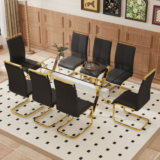 Modern glass dining table with gold frame and black chairs