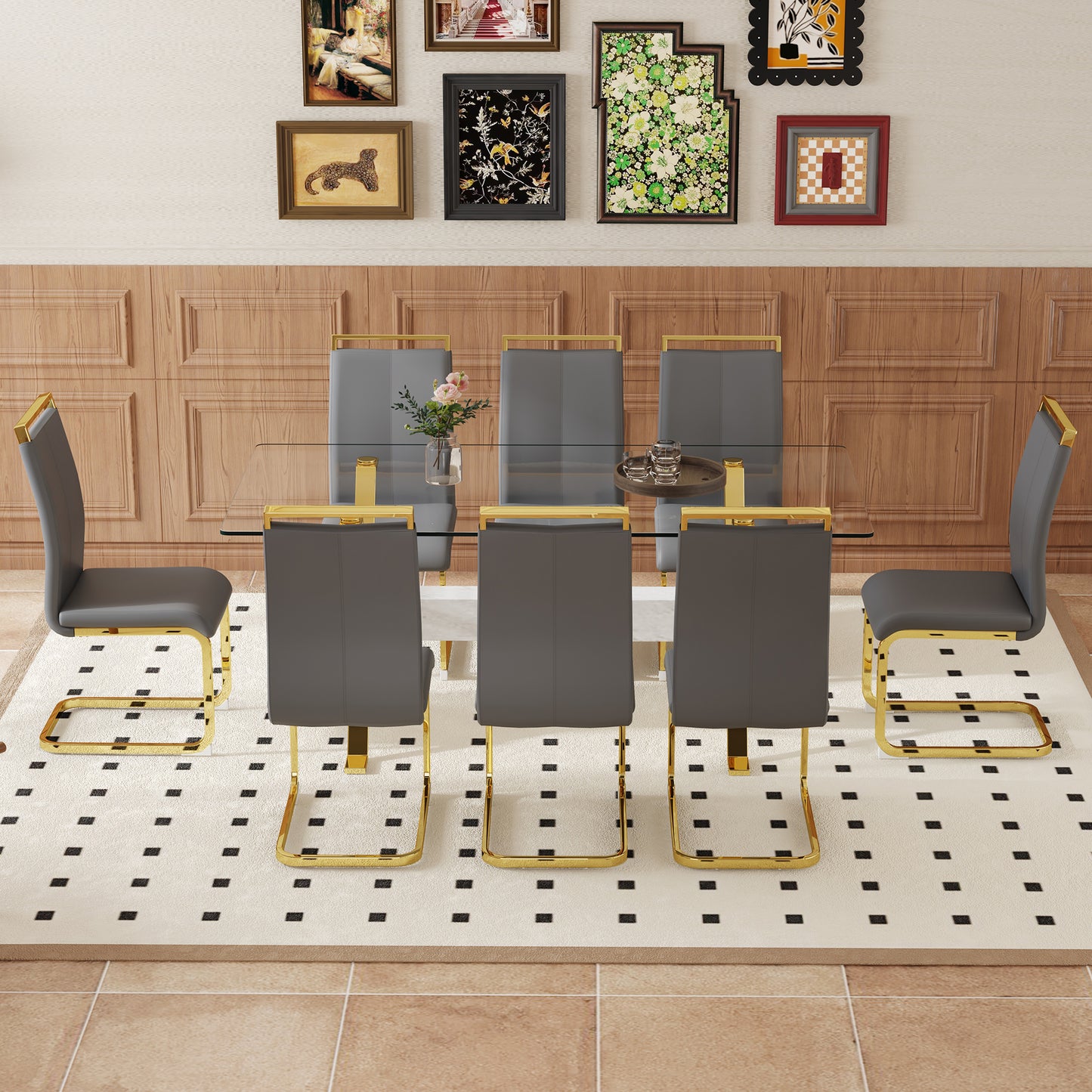 Dark gray faux leather dining chairs with gold sled legs