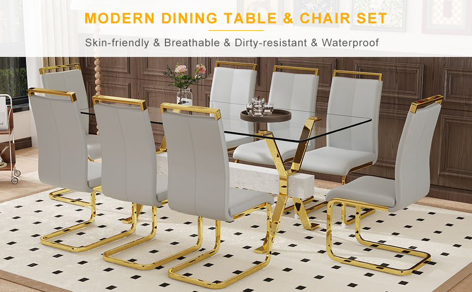 Modern glass dining table with gold legs and white chairs