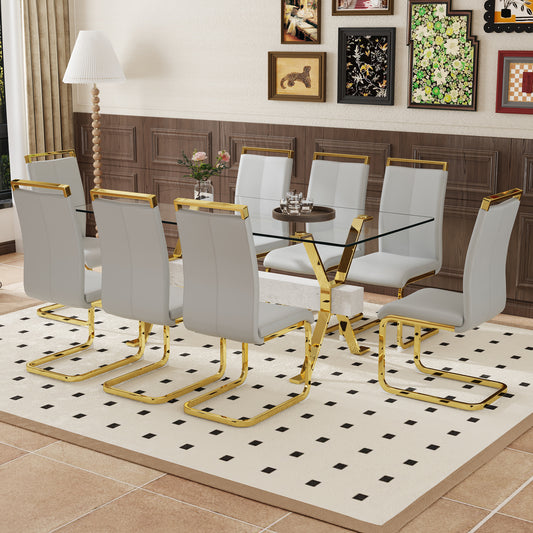 Modern grey faux leather dining chairs with gold metal legs