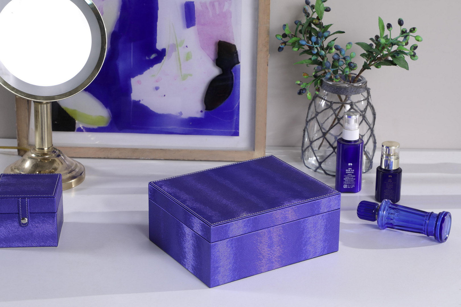 Large purple textured storage box with white stitching detail