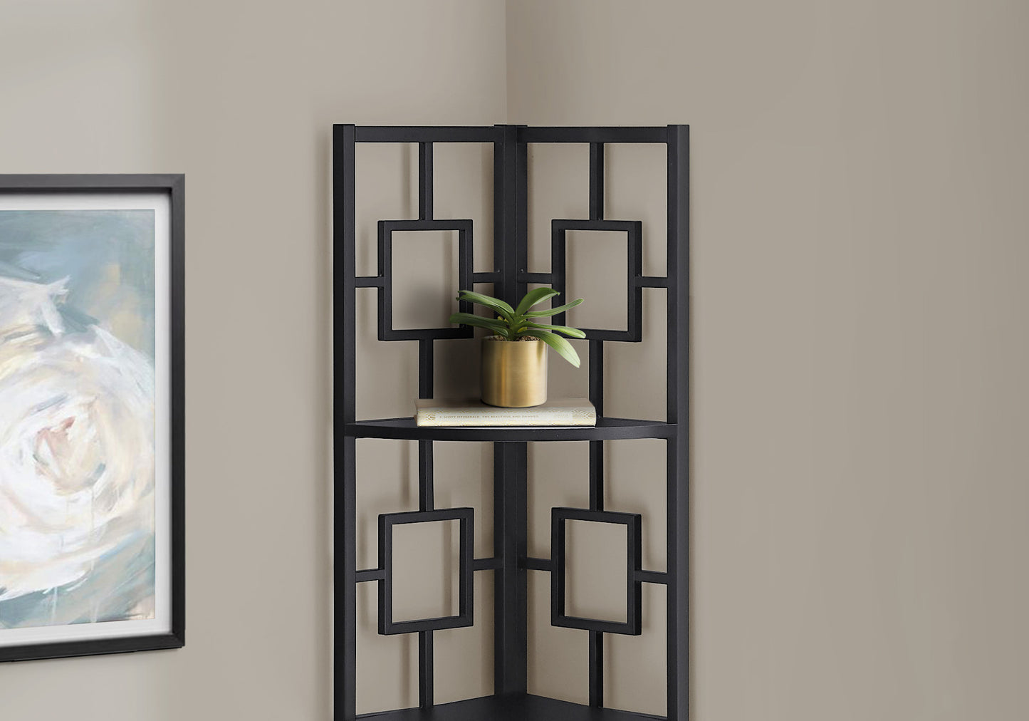 Black geometric metal corner shelf with faux plant and book