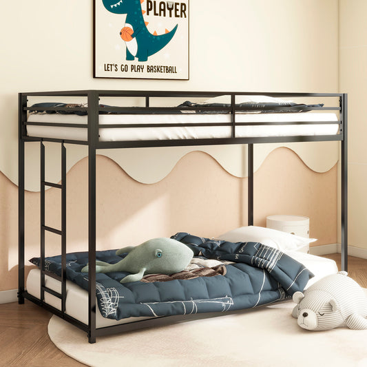 Black metal twin over twin bunk bed with white mattresses and navy bedding