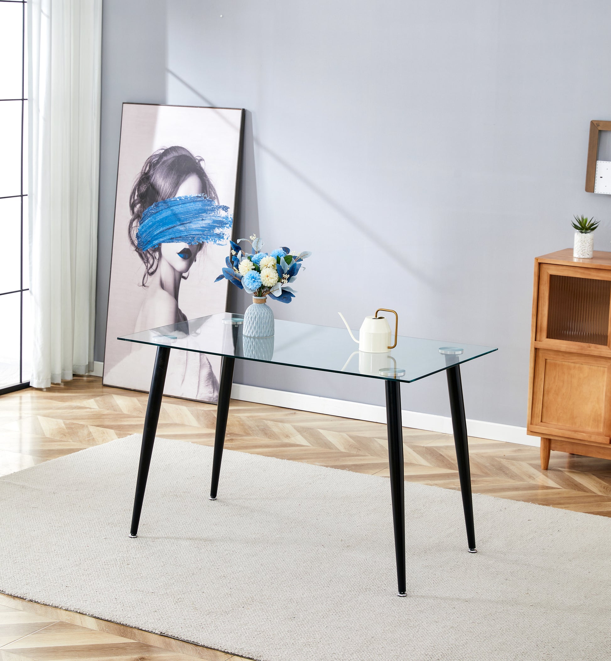 Glass top dining table with tapered black legs