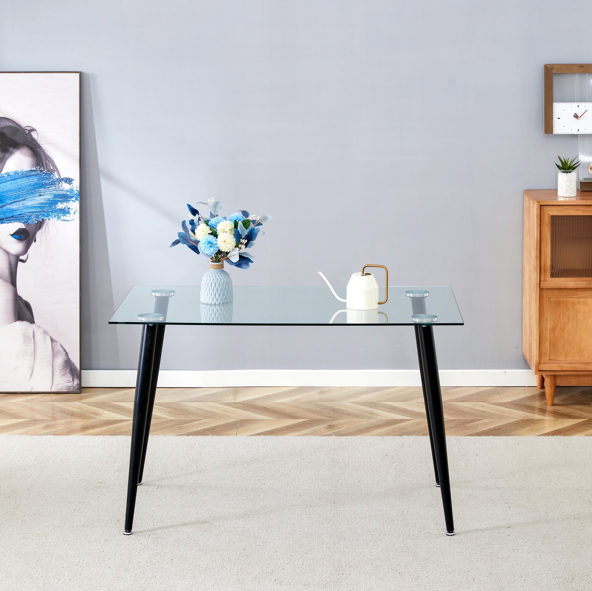 Clear glass dining table with black tapered legs
