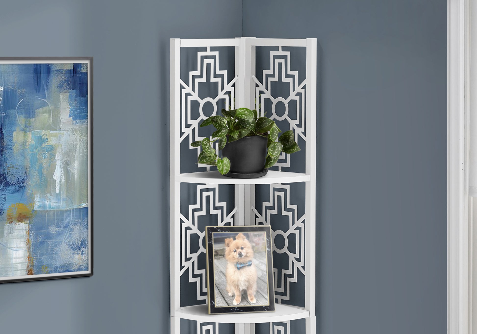 White geometric corner shelf with a potted plant