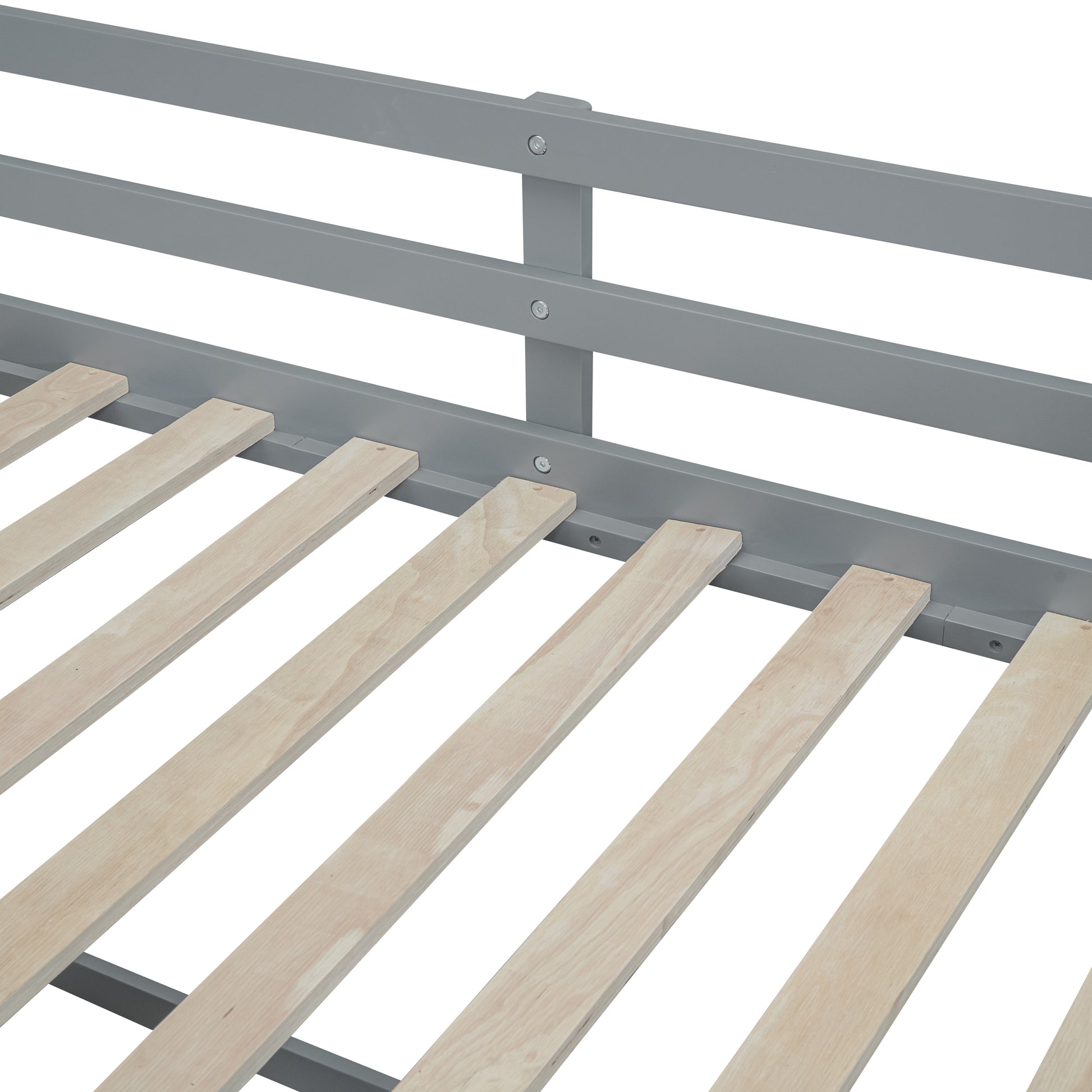 Closeup of a grey metal bed frame with natural wood slats