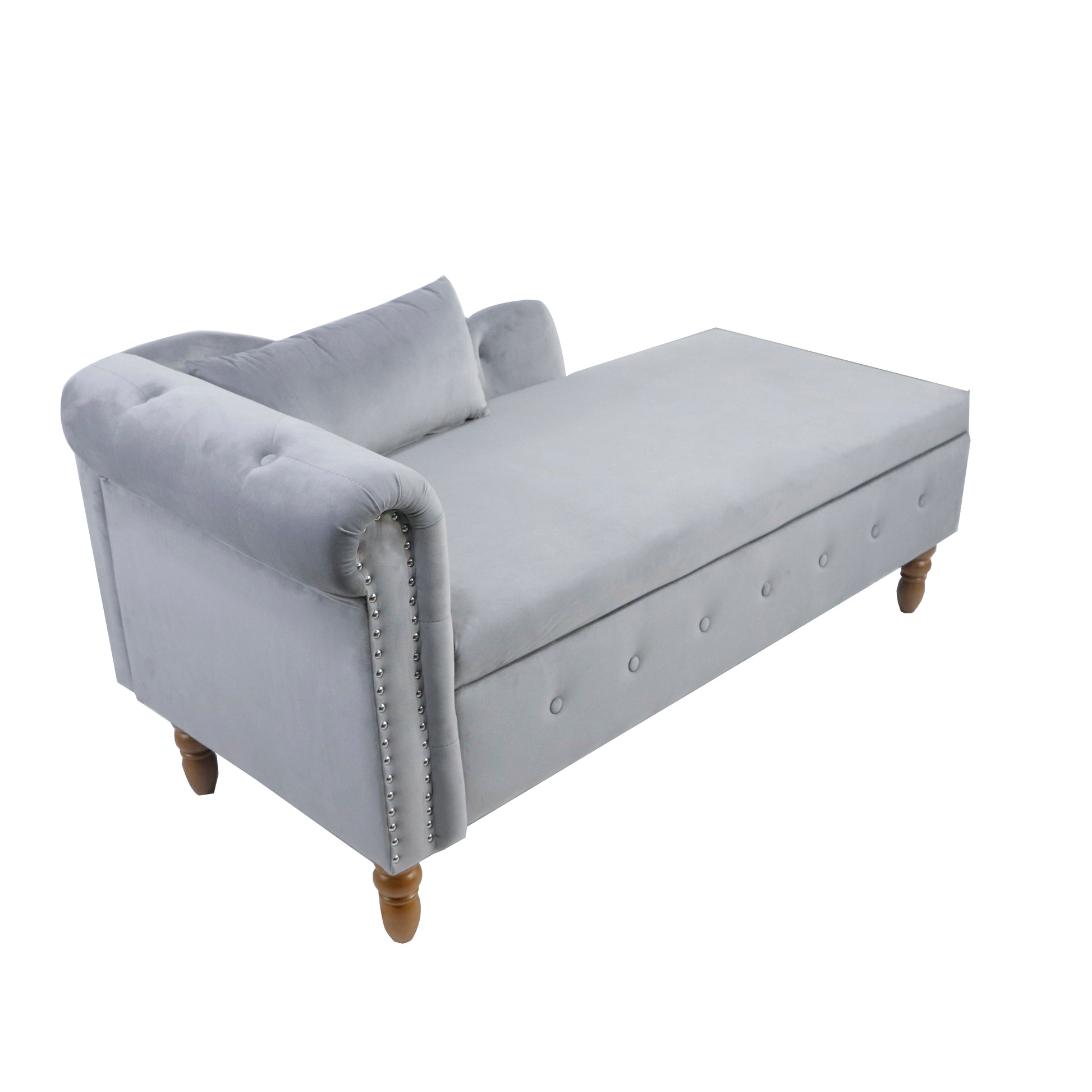 Light grey velvet chaise lounge with tufted buttons and nailhead trim