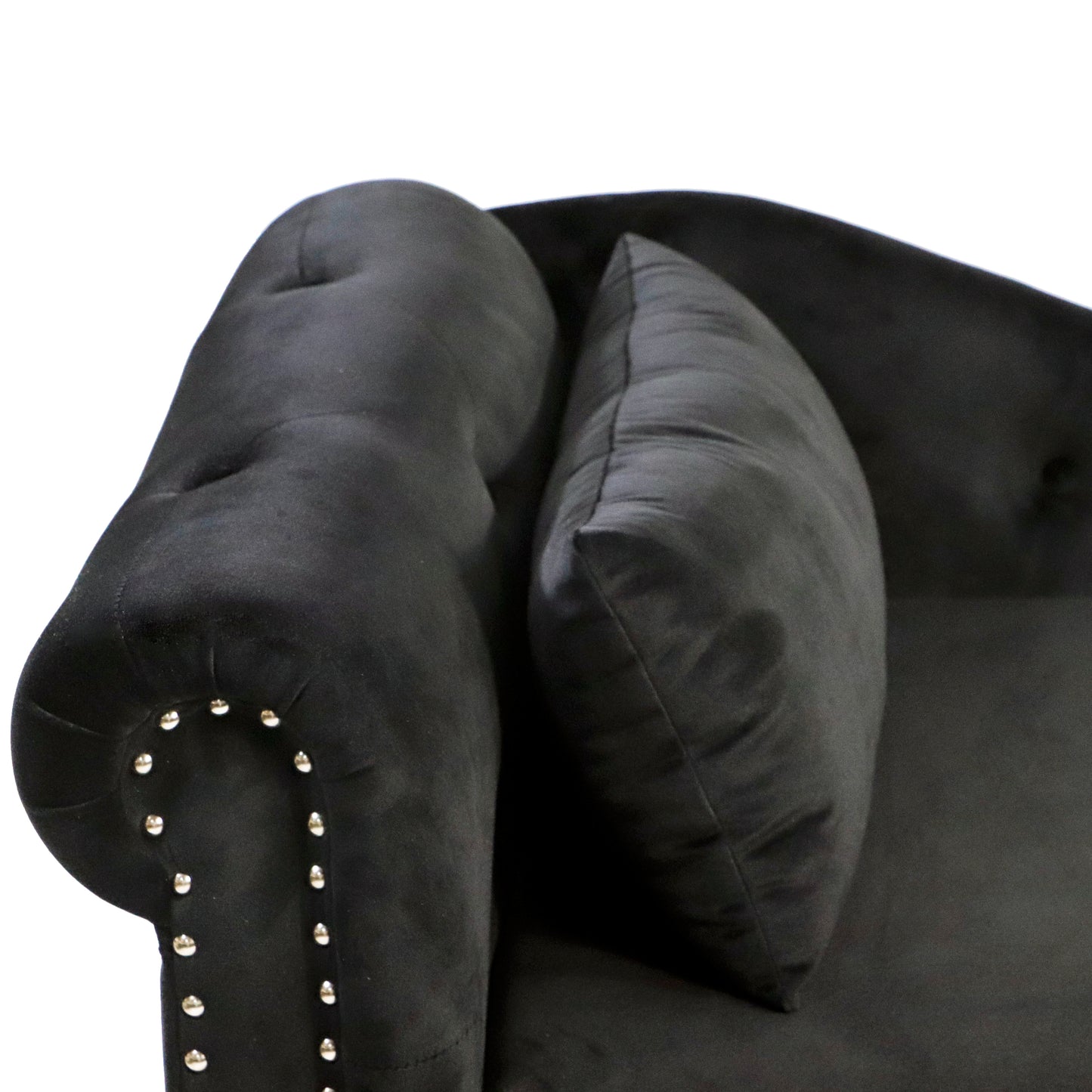 Black velvet armchair with button tufting and silver nailhead trim