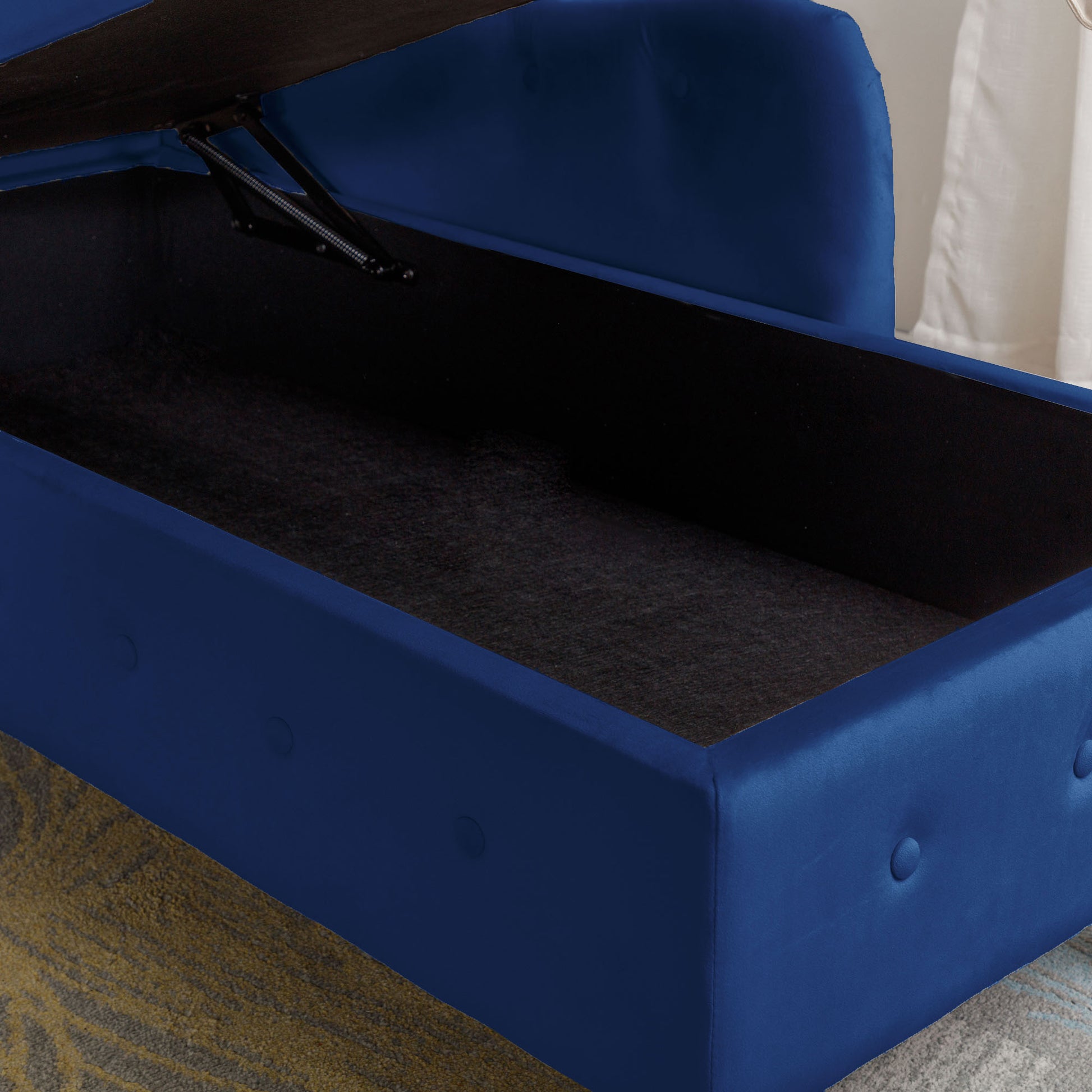 Deep blue velvet storage ottoman with lifttop mechanism and button tufted accents
