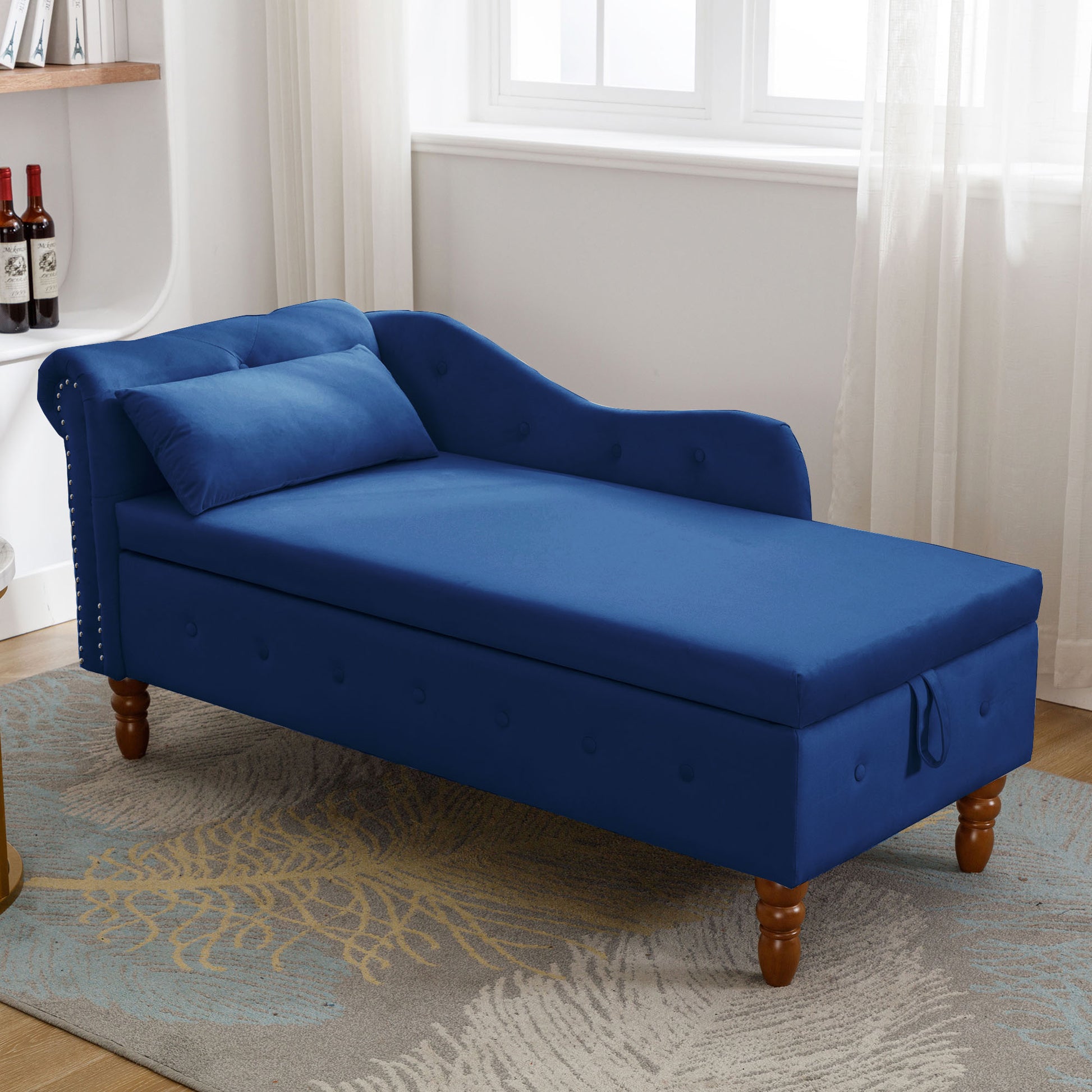 Elegant blue velvet chaise lounge with tufted details and storage