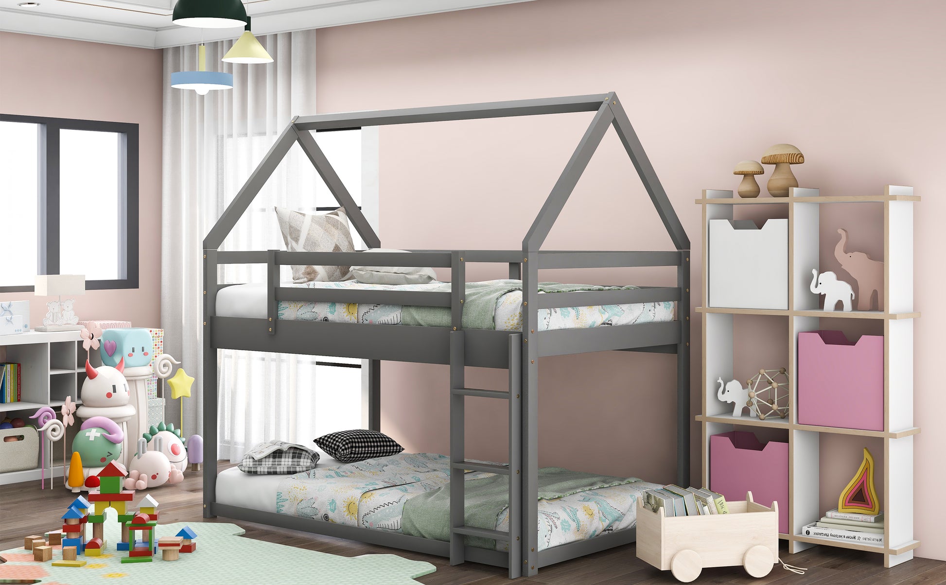 Gray wooden twin house bunk bed with playful bedding and stuffed animals