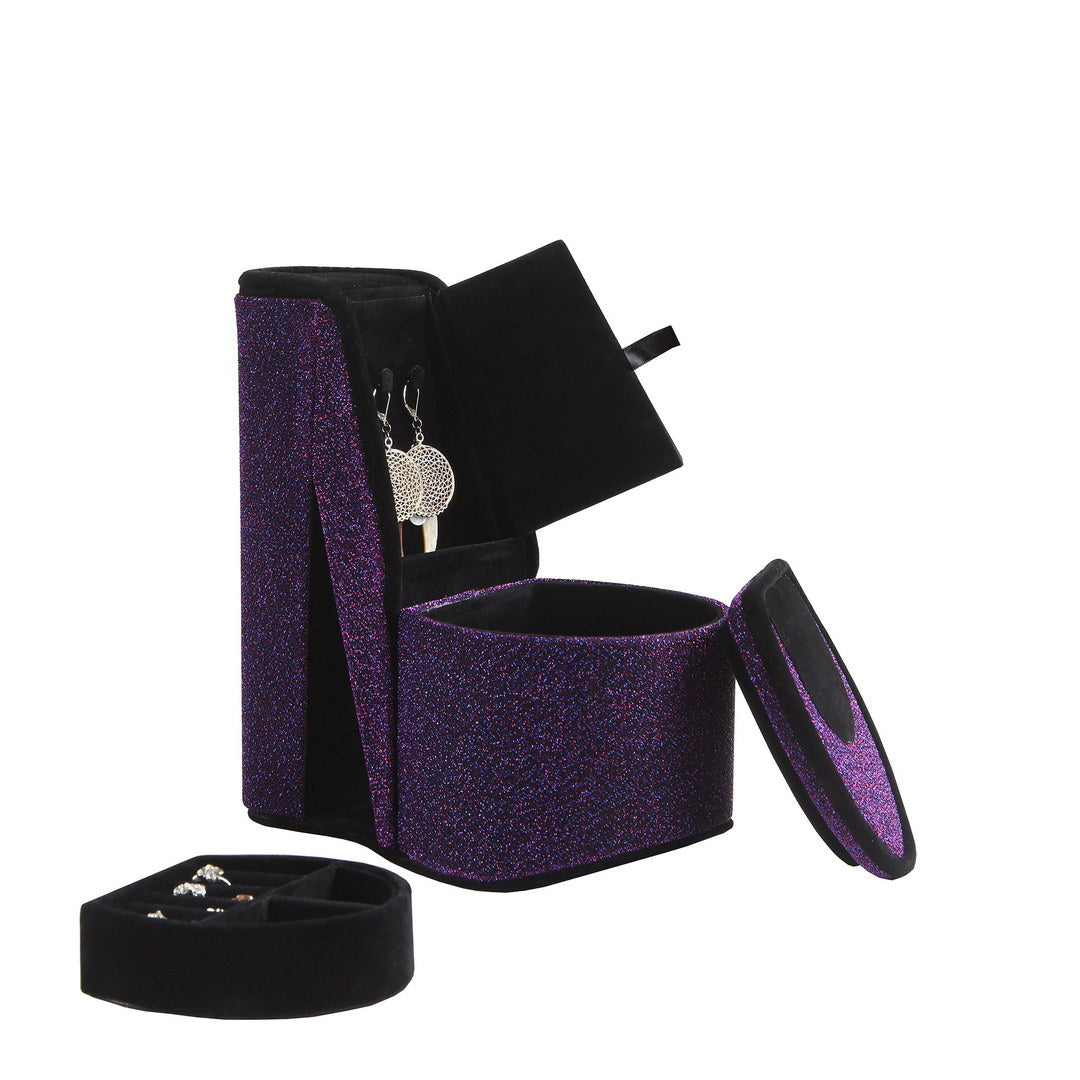 Sparkling purple jewelry organizer with velvet lining holding earrings and a ring tray